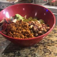 Vegan Taco Bowl · Plant based Chorizo sausage, pinto beans, lettuce, fresh salsa, jalapenos, guacamole and cor...