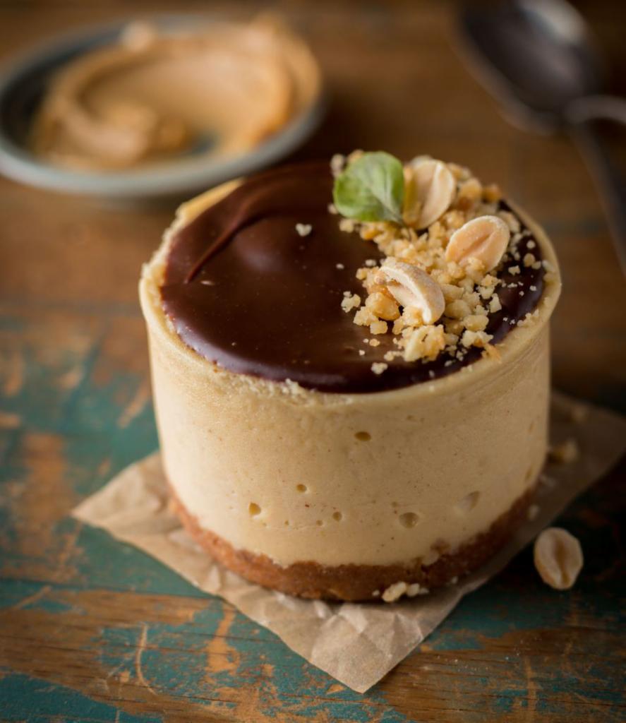 Peanut Butter Dream (PBC) · The best of both worlds — peanut butter and chocolate! Our luscious filling is blended with peanut butter goodness and topped with a dreamy chocolate ganache and salted peanuts. Heaven!  
