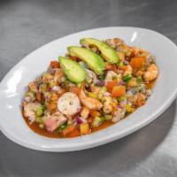Ceviche Marea Negra · Black sea ceviche. Raw chopped shrimp, cooked shrimp, cooked octopus, cucumber, tomato, red ...