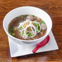 Lao Pho · Rice noodles with beef broth. Toppings included are meatballs and beef slices. Garnished wit...