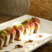 Makimoto Roll · Spicy tuna, crab and tempura asparagus wrapped with garlic seared tuna and avocado.