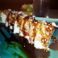 Surf and Turf Roll · Shrimp and asparagus tempura with avocado wrapped in seared rare filet mignon, topped with g...