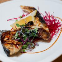 Hamachi Kama · Grilled yellowtail jaw with salt, black pepper, and eel sauce.