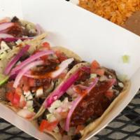 Combo 1 · 3 carne asada tacos, rice and beans, soft drink