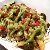 Carne Asada Fries Basket · Basket of fries with carne asada and cheese.