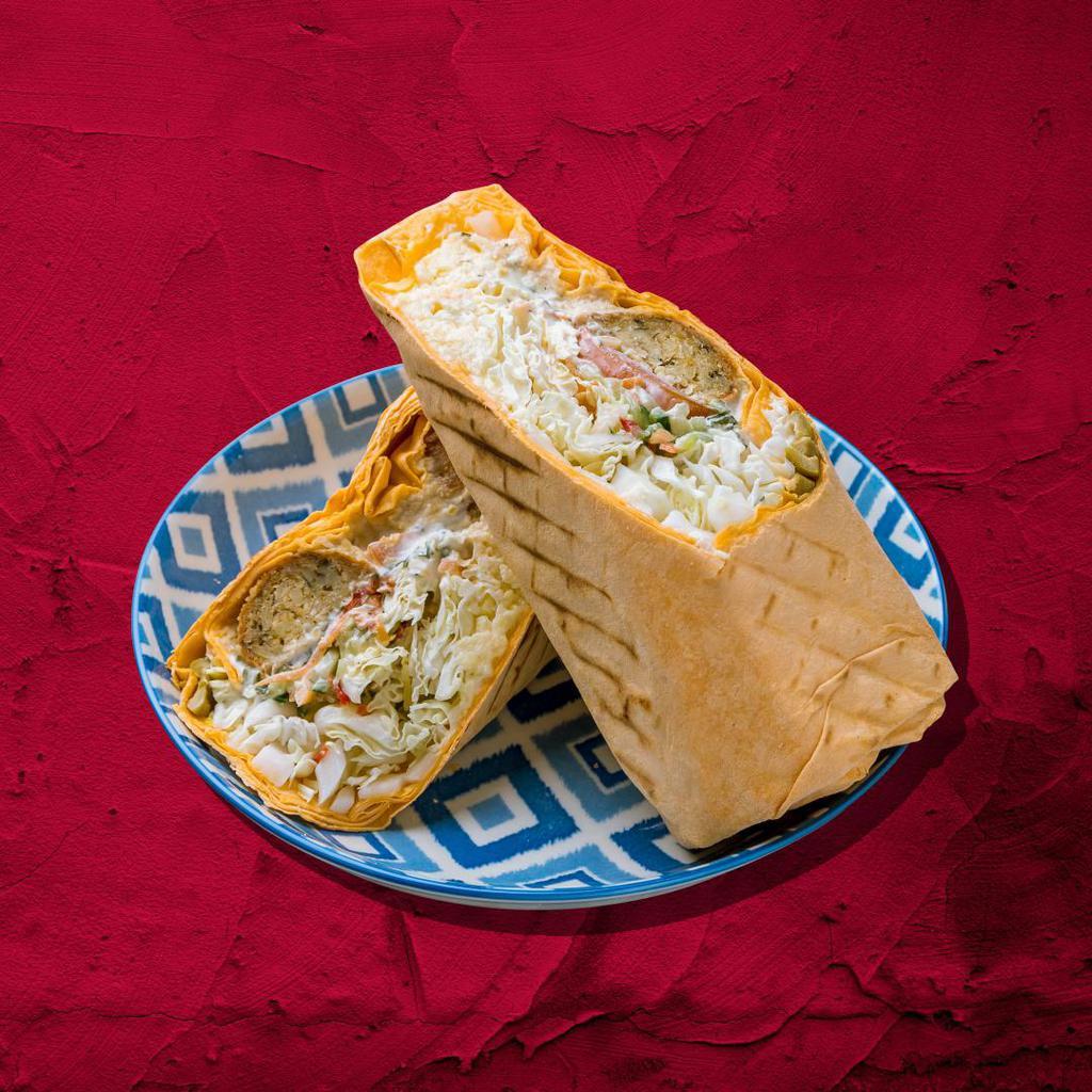 Hummus Wrap Sandwich Surprise · With your choice of traditional or roasted red pepper hummus, spinach, tomatoes, cucumbers, black olives, and red onions wrapped to perfection.
