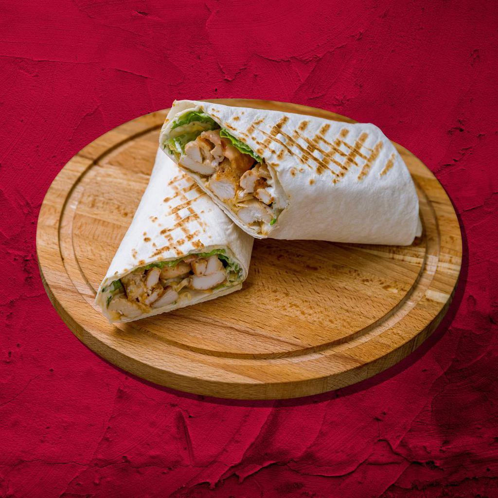 Chicken Caesar Wrap Sandwich · Chicken and bacon, romaine lettuce, parmesan, caesar dressing, and garlic romano seasoning wrapped to perfection.
