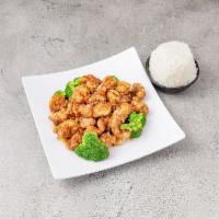 S2. Orange Chicken · Marinated chunks of chicken fried and sauteed with orange flavored tangy brown sauce served ...