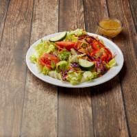 Garden Salad · Fresh lettuce, green peppers, tomatoes, and cucumber.