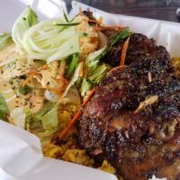 Jerk chicken Platter · Jerk chicken Marinated and roasted to perfection (leg quarter) comes with curry rice, side s...