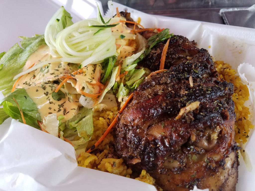 Jerk chicken Platter · Jerk chicken Marinated and roasted to perfection (leg quarter) comes with curry rice, side salad and special sauce