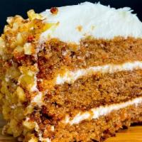 Carrot Cake · Incredibly moist cake layered with cream cheese frosting and walnuts