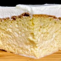 Tres Leches · Light sponge cake soaked in a mixture of three milks and topped with icing 