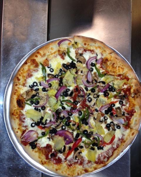 Veggie Delight Pizza · Mushrooms, black olives, artichoke hearts, garlic, onions, green peppers and mozzarella cheese.  