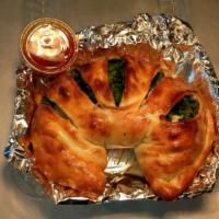 Johnnie's Combo Calzone · Pepperoni, sausage, mushrooms, onions, garlic, green bell peppers, mozzarella cheese, and pi...