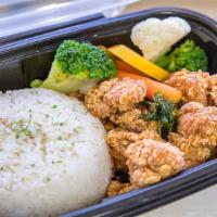 Popcorn Chicken Over Rice · Basil popcorn chicken served with rice and mixed vegetables 