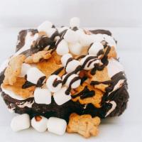 Jumbo S'mores Brownie · Jumbo Triple fudge brownie topped with marshmallow cream, mini marshmallows, graham crackers...