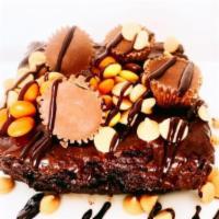Jumbo Reese's Eggplosion Brownie · Jumbo Triple Fudge Brownie topped with Reese's Peanut Butter cups, Reese's Pieces and chocol...