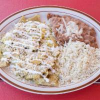 Chilaquiles Verdes con Huevos · Green sauce chilaquiles and scrambled egg. Served with cheese and sour cream. 