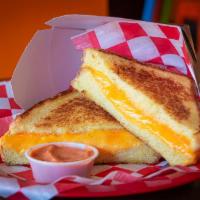 The OG · American and Cheddar Cheese Spread on Texas Toast.  Served with Tomato Soup Dip.
