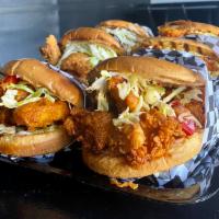 Spicy Rad Chicken Burger · Fried chicken breast, onions, pickles, coleslaw, calabrian chile, spicy mud sauce, & Rad sau...