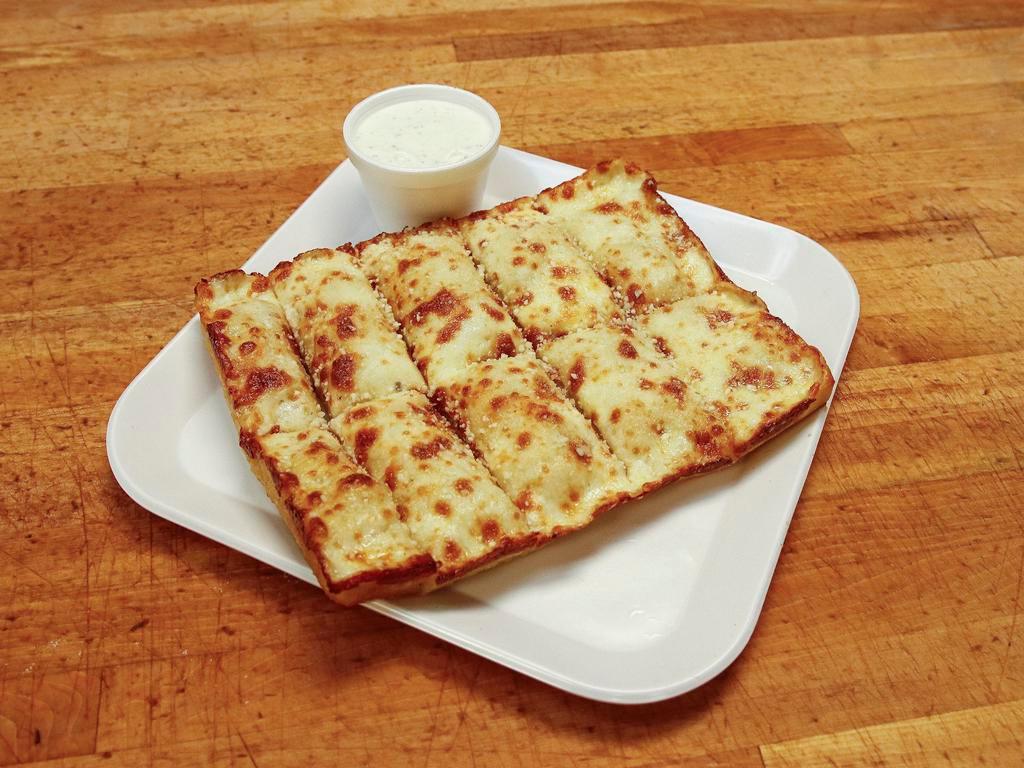 Cheesy Bread · Cheesy pieces with baked mozzarella, Parmesan cheese and garlic butter. Served with sauce.
