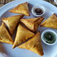 Sambusas 7 · A savory pastry enjoyed across Africa, delicately spiced with exotic flavors. Spicy beef, ch...