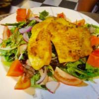 Talapia African Garden Salad · Grilled fillet of tilapia seasoned with African spices on a bed of farmers market spring mix...