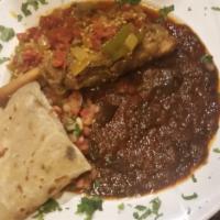 Lamb Curry · Tender lamb seasoned in African spices and slow cooked in a yellow curry sauce includes biri...