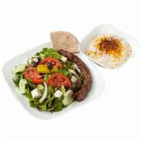 Sirloin Kubideh Platter · A juicy strip of ground sirloin steak marinated in our homemade seasoned and ground with oni...