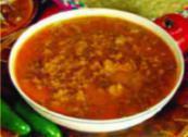 Chile Con Carne · Tender round steak cubed and braised simmered with a secret spicy sauce. Served with beans, ...