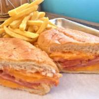 3. Dominican Classic Sandwich · Clasico dominicano. Served with ham, cheese, tomatoes, mayo and ketchup.