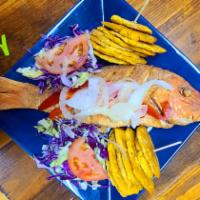 4. Red Snapper Fish · Pescado Frito. Served with a side order of tostones, rice and beans or veggies.