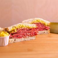 Corned Beef Sandwich · Our world Famous Corned Beef, hand carved onto your choice of bread, with your choice of top...