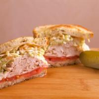 Skipper Sandwich · Oven roasted turkey breast on grilled rye with melted Swiss cheese, tomatoes, coleslaw and 1...