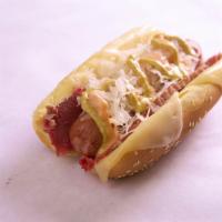 Reuben Dog · Our Signature Sandwich on top of a Hot Dog!  Corned beef, Swiss cheese, Sauerkraut, 1000 Isl...