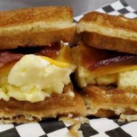 The Woofle sandwich · Egg, bacon, american cheese, sandwiched between half of a made-to-order waffle