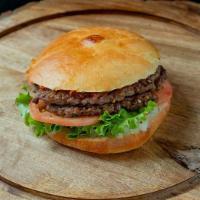 The Luk · Two 1/3 lb Chuck Patties, Red Crushed Pepper, 11/11 Spicy Sauce, Lettuce, Tomato, Onions, on...