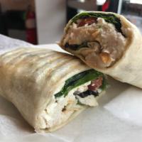 Greek Chicken Wrap · Grilled chicken breast marinated on olive oil and roasted garlic herbs, feta cheese, lettuce...