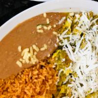 Chilaquiles Breakfast · 2 eggs, sliced tortillas simmered in red or green sauce, cheese served with rice, beans, let...