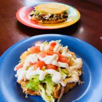 Sopes · Soft corn dough served with choice of meat, beans, lettuce, tomato, onion, cheese, and sour ...