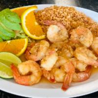 Camarones al Mojo de Ajo · Garlic shrimp. Served with rice, salad and corn or flour tortillas.