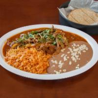Rib Eye Steak in Arbol Pepper Sauce · Served with rice, beans, and corn or flour tortillas.