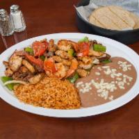 Trio Fajitas · Shrimp, chicken and steak. Served with rice, beans, and corn or flour tortillas.