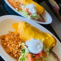 Chimichanga · Chicken, ground beef and steak. Topped with cheese sauce, lettuce, tomato, and sour cream. S...