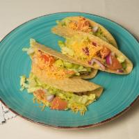 Hard Tacos · Beef or chicken, hard taco shells, lettuce, taco sauce, cheese, tomato, sour cream and onion.