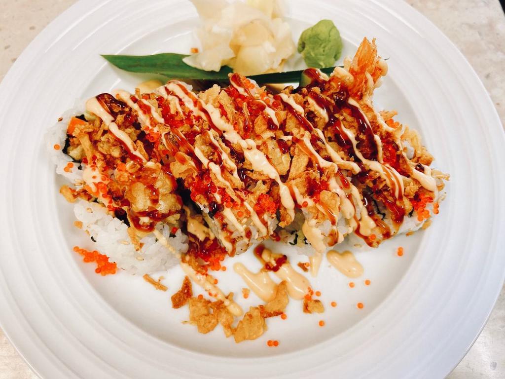 Crunchy Special Roll · Inside: shrimp tempura, pickled burdock cucumber.
On top: fried onion flake, flying fish egg, flying fish egg(tobiko), spicy mayo, sweet sauce.