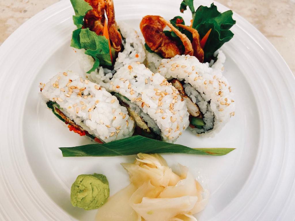 Spider Special Roll · Inside: deep fried soft shell crab, avocado, pickled burdock, flying fish egg (Tobiko), green leaf.
On top: sesame seed.