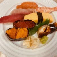 Nigiri B · Tuna, salmon, yellowtail, shrimp, uni(sea urchin),  ikura(salmon roe), eel and egg.