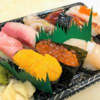 Deluxe Nigiri · Tuna, Scallop, Hamachi (Yellow tail), Sweet shrimp, Eel, Cockle, Sea urchin and Salmon egg